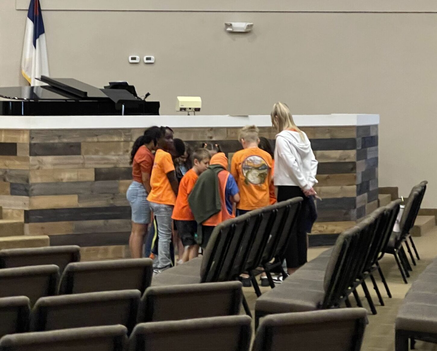 Praying students in the auditorium