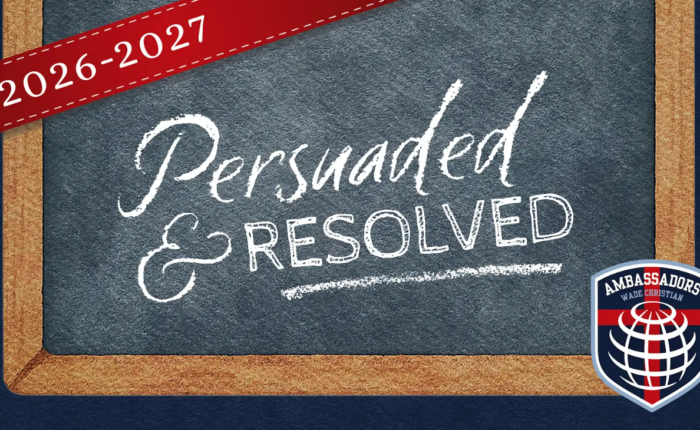 Chalk board with the text "Persuaded & Resolved" written on it.